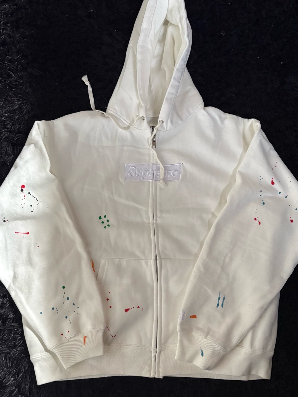 Supreme White Zip-Up Hoodie with Multicolor Paint Accents